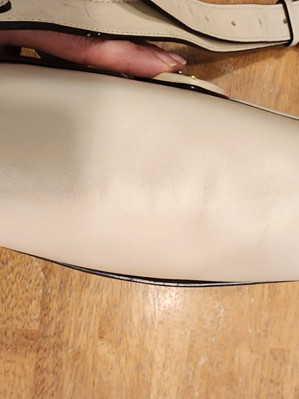 2021 Ivory Coach Beat saddle bag is crafted from glovetanned leather and brass